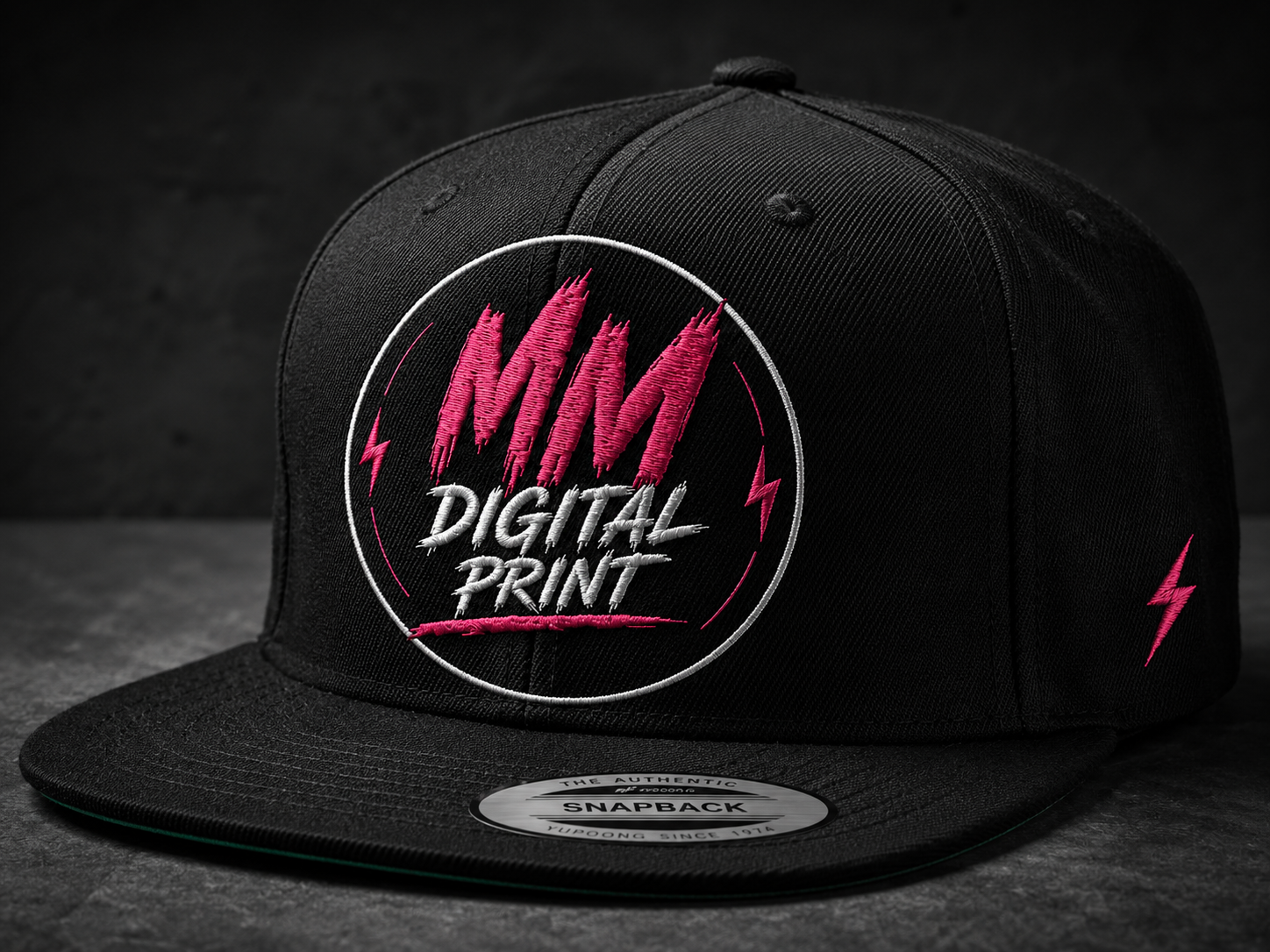 Black snapback cap with pink embroidered MM Digital Print logo